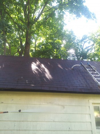 Pressure Washing the exterior walls and roof of a house in Englewood, NJ
